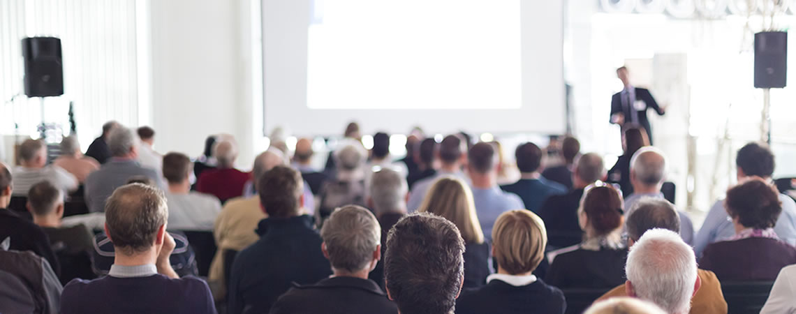 Clinical speaker presenting at a WACS aesthetics conference